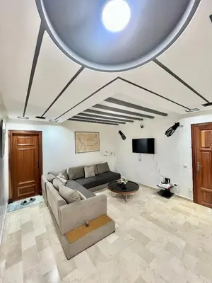 a living room with a couch and a table at Le repos parfait in Casablanca