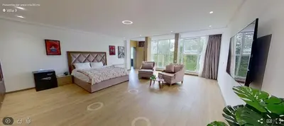 a bedroom with a bed and a couch and a chair at Villa 9- luxurious 5 bedrooms villa in the heart of Ambassadors in Rabat