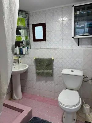 a bathroom with a toilet and a sink at Hôte Nadia in Casablanca