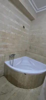 a bath tub with a faucet in a bathroom at Val danfa in Casablanca