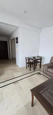 a living room with a couch and a table at Val danfa in Casablanca