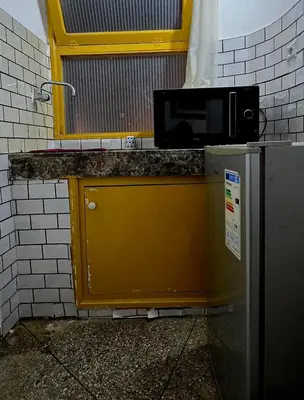 a microwave sitting on top of a counter at 16 dreams in Rabat