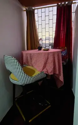 a table and chairs with a red and white table cloth at 16 dreams in Rabat