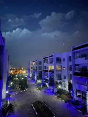 an empty street in a city at night at Cozy apartment Sea view & Comfort in Mohammedia
