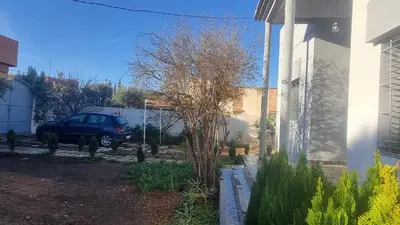 a car parked in a yard next to a building at ALTIS Immo Authentic House in Casablanca
