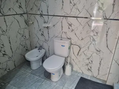 a bathroom with a toilet and a bidet at ALTIS Immo Authentic House in Casablanca