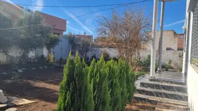 a garden with green plants next to a house at ALTIS Immo Authentic House in Casablanca