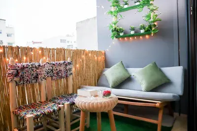 a patio with a couch and a table and lights at R108- Gorgeous & Cosy Aprt with Wifi, Parking and Gym at the heart of Bourgogne in Casablanca-Port
