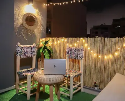 a table and two chairs with a laptop on it at R108- Gorgeous & Cosy Aprt with Wifi, Parking and Gym at the heart of Bourgogne in Casablanca-Port