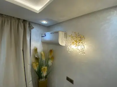a room with a air conditioner on the wall at Apartement charmante amira in Oulad Kerroum