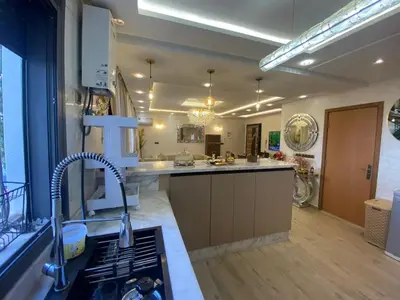 a kitchen with a sink and a counter top at Apartement charmante amira in Oulad Kerroum