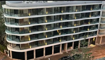 an overhead view of a tall building with many windows at Blue in Maarif
