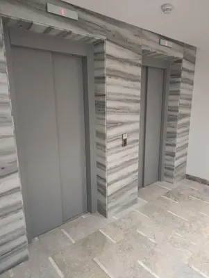 a row of three doors in a room at Naturalia Appart & Hotel - Casa Center in Casablanca
