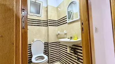 a bathroom with a toilet and a sink at Super appart vue sur mer in Rabat