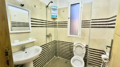 a bathroom with a toilet and a sink at Super appart vue sur mer in Rabat