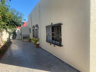 a building with a window on the side of it at Tradition & Modernité in Rabat