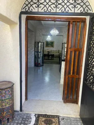 an open door to a room with a living room at Tradition & Modernité in Rabat