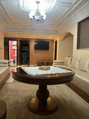 a living room with a couch and a table at Appartement Rabat in Rabat