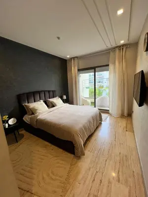 a bedroom with a large bed and a large window at Cozy Flat with Gym, fast WiFi and Great Location in Casablanca