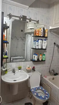 a small bathroom with a sink and a toilet at Palm Beach in Mansouria