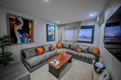 a living room with a couch and a table at Atlantic View in Casablanca