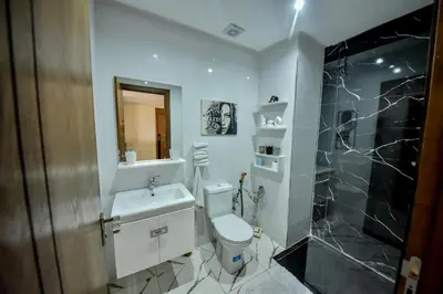 a bathroom with a toilet and a sink and a shower at Atlantic View in Casablanca