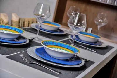 a table with plates and wine glasses on it at Atlantic View in Casablanca