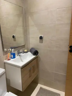 a bathroom with a sink and a mirror at Sidi Rahal beach apartment Heaven beach in Sidi Rahal