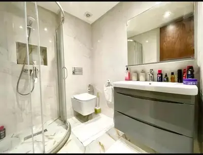 a bathroom with a shower and a toilet and a sink at Marco in Casablanca