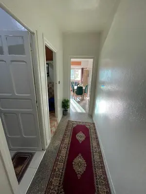 a hallway with a red rug on the floor at Cozy Studio in Diour Jammae in Rabat