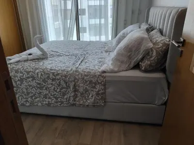 a bed with pillows on it in a bedroom at Les terrace d'anfa in Casablanca