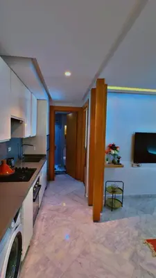 a kitchen with a sink and a stove at Les terrace d'anfa in Casablanca