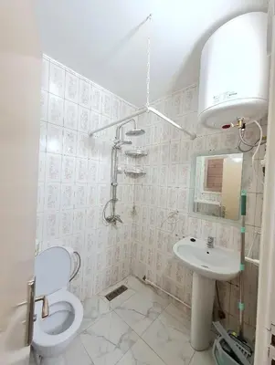 a bathroom with a toilet and a sink at Newly Apartment refurbished central calm charming in Rabat