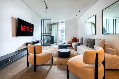 a living room with a couch and chairs at Luxury Apartment Anfaplace style & elegant in Casablanca