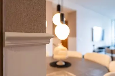 a dining room with a table and a lamp at Luxury Apartment Anfaplace style & elegant in Casablanca