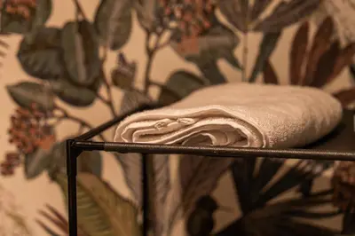 a towel on a towel rack in front of a wall at Luxury Apartment Anfaplace style & elegant in Casablanca