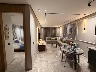a living room with a couch and a table at MetroSuite in Casablanca