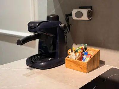 a coffee maker sitting on a counter next to a wooden box at MetroSuite in Casablanca