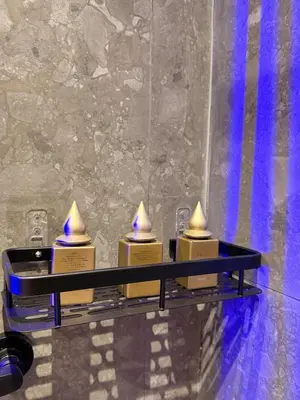 a row of candles on a shelf in a bathroom at MetroSuite in Casablanca