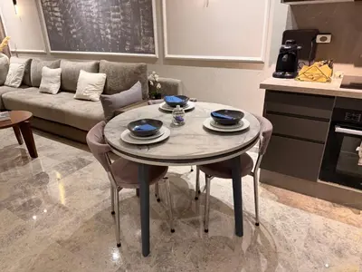 a living room with a table and a couch at MetroSuite in Casablanca