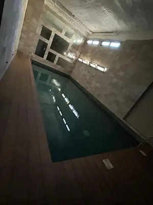 an overhead view of a swimming pool in a building at Résidence Natura Living in Mohammedia