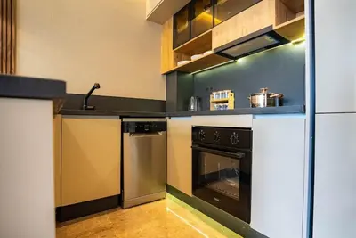 a kitchen with a stove and an oven at The Stay of Dreams - Sea View and Pool Access in Casablanca