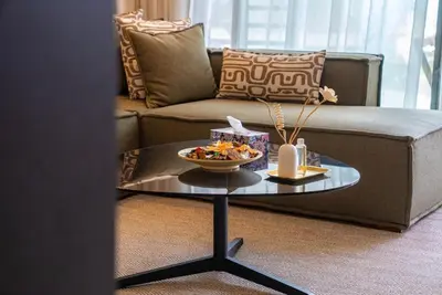a living room with a couch and a coffee table at The Stay of Dreams - Sea View and Pool Access in Casablanca