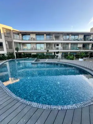 a large swimming pool in front of a building at The Stay of Dreams - Sea View and Pool Access in Casablanca