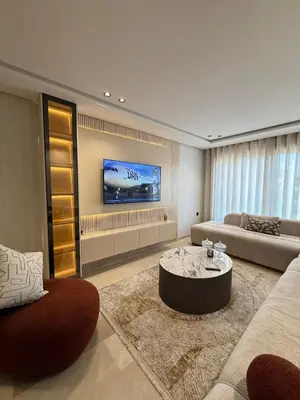 a living room with a couch and a coffee table at Cosy cocon central in Le Polo