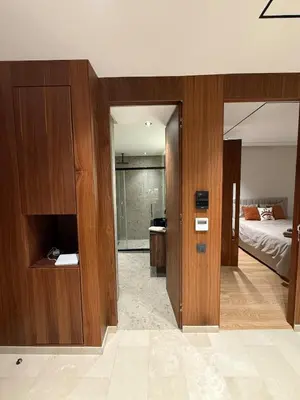 a room with a bedroom with a bed and a mirror at Cozy and chic apartment in Casablanca in Casablanca