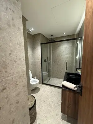 a bathroom with a shower and a sink and a toilet at Cozy and chic apartment in Casablanca in Casablanca