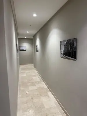 a hallway with a wall with a television on it at Modern studio in Burgundy in Casablanca-Port