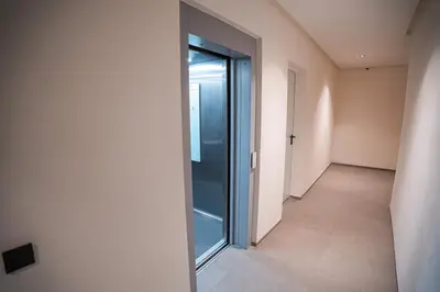 an empty hallway with a glass door in a building at Skyline View Luxury Private Parking - Netflix in Casablanca