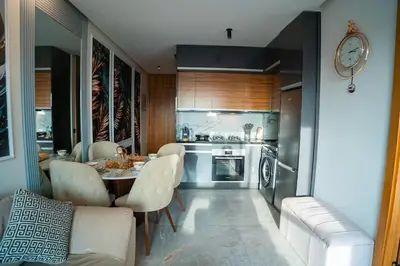 a kitchen with a table and chairs in a room at Skyline View Luxury Private Parking - Netflix in Casablanca